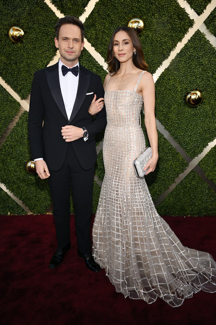 Patrick J. Adams and Troian Bellisario at the 81st Golden Globe Awards held at the Beverly Hilton Ho...