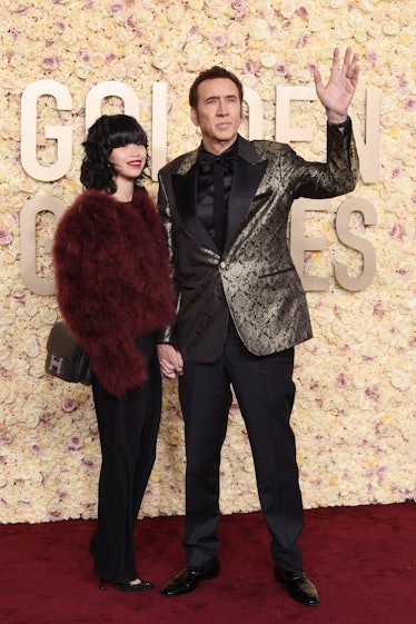 Riko Shibata and Nicolas Cage attend the 81st Annual Golden Globe Awards at The Beverly Hilton on Ja...