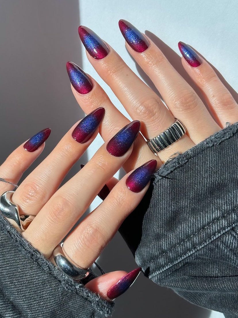 This glittering aura manicure is a unique take on the cat eye nail art trend.