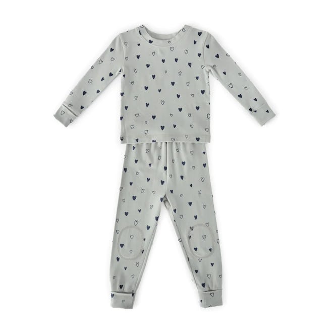 valentine's day pajamas: Child's pajama set with heart patterns on a white background.