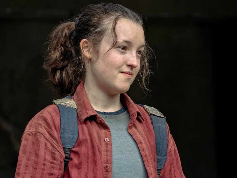 A young woman with a ponytail, wearing a red shirt over a gray tee, with a backpack, looking to the ...