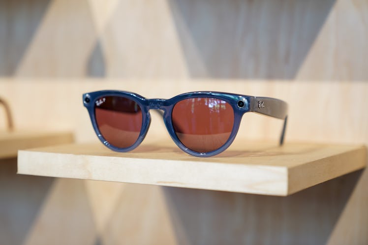 Blue Ray-Ban Meta Smart Glasses sitting on a shelf.