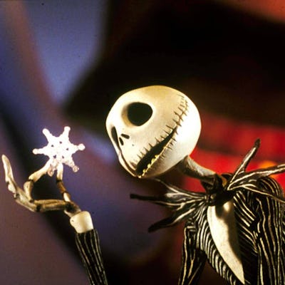A skeletal character with a large, expressive skull holds a snowflake delicately in his hand, set against a blurred, colorful background.
