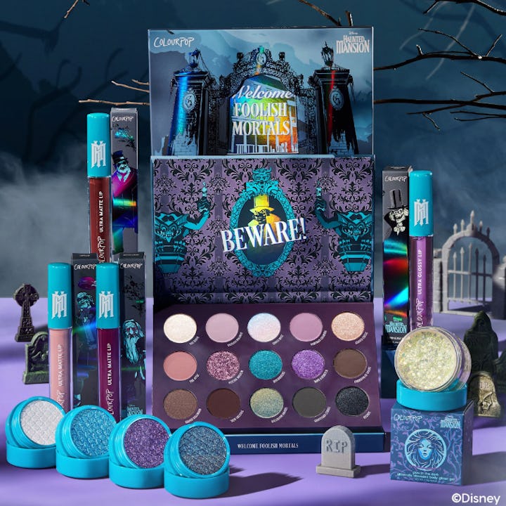 A colorful makeup collection themed around a spooky mansion, featuring eyeshadows, glitter, and bold...
