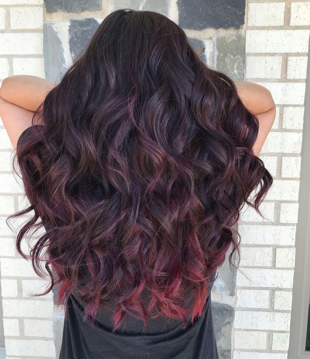 Dark mulberry hair is on-trend for winter 2024.