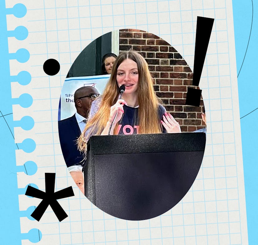 A young woman with long hair speaks into a microphone at a podium, passionately addressing an audien...