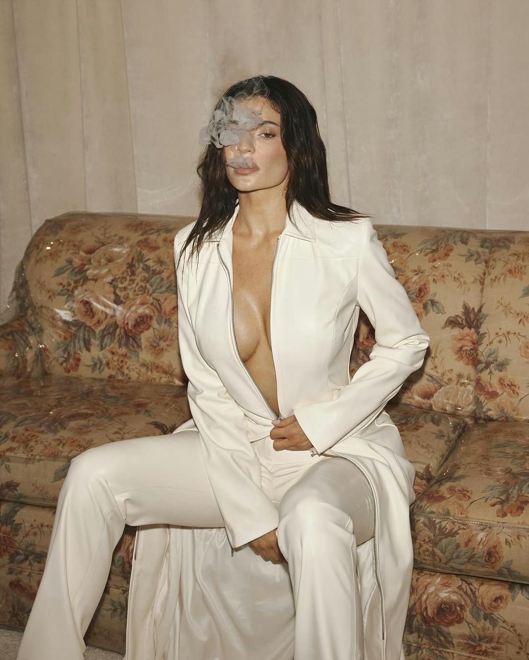 Kylie Jenner wears a faux leather trench.