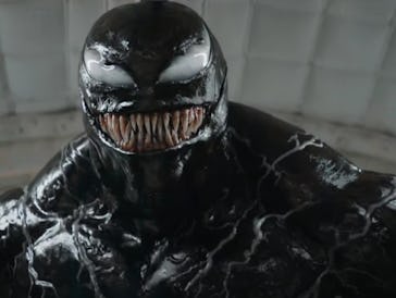 A terrifying, muscular black creature with a wide, menacing grin and sharp teeth, set against a ligh...