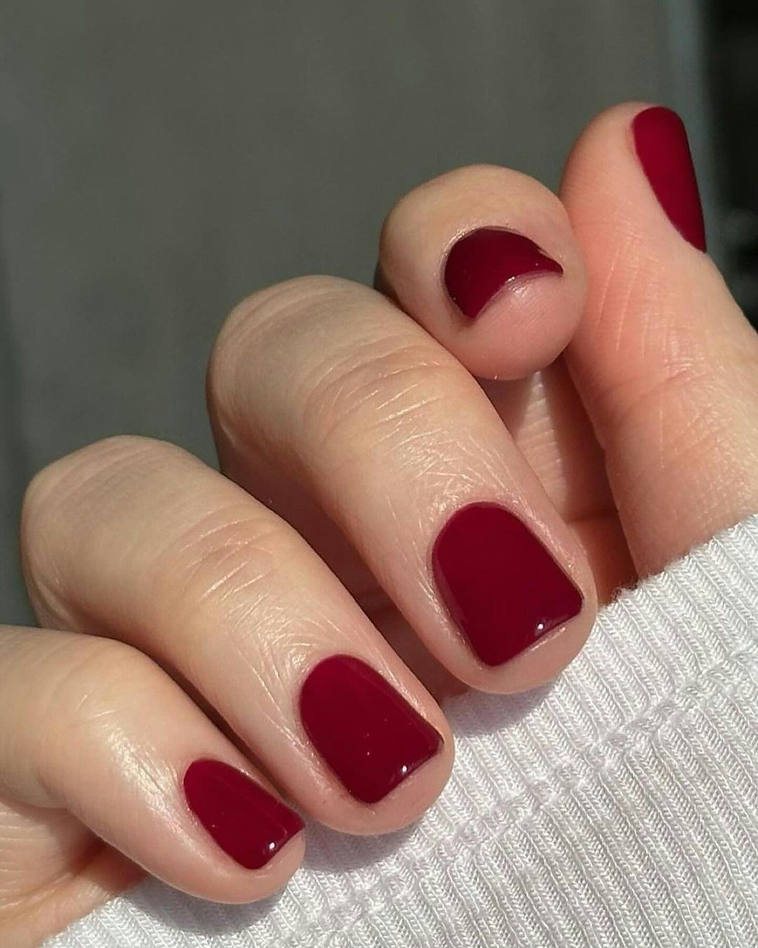 Dark red nails are on-trend for winter 2025.