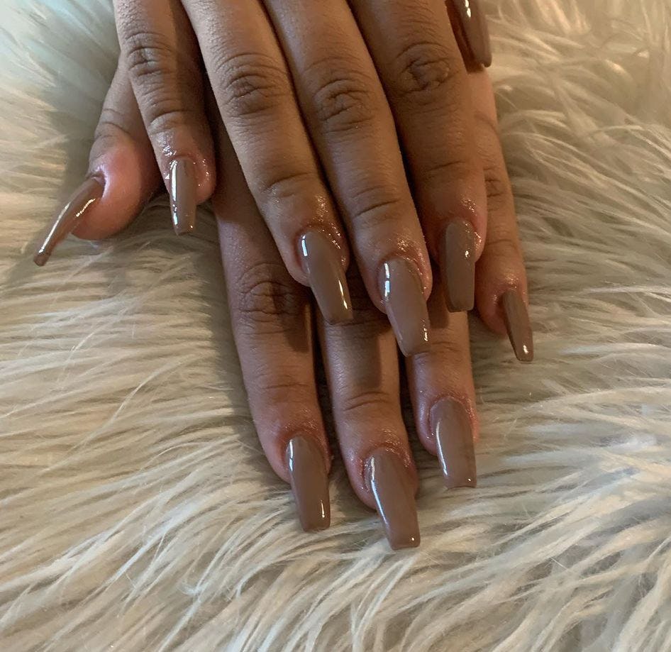 Mid-tone beige nails are on-trend for winter 2025.