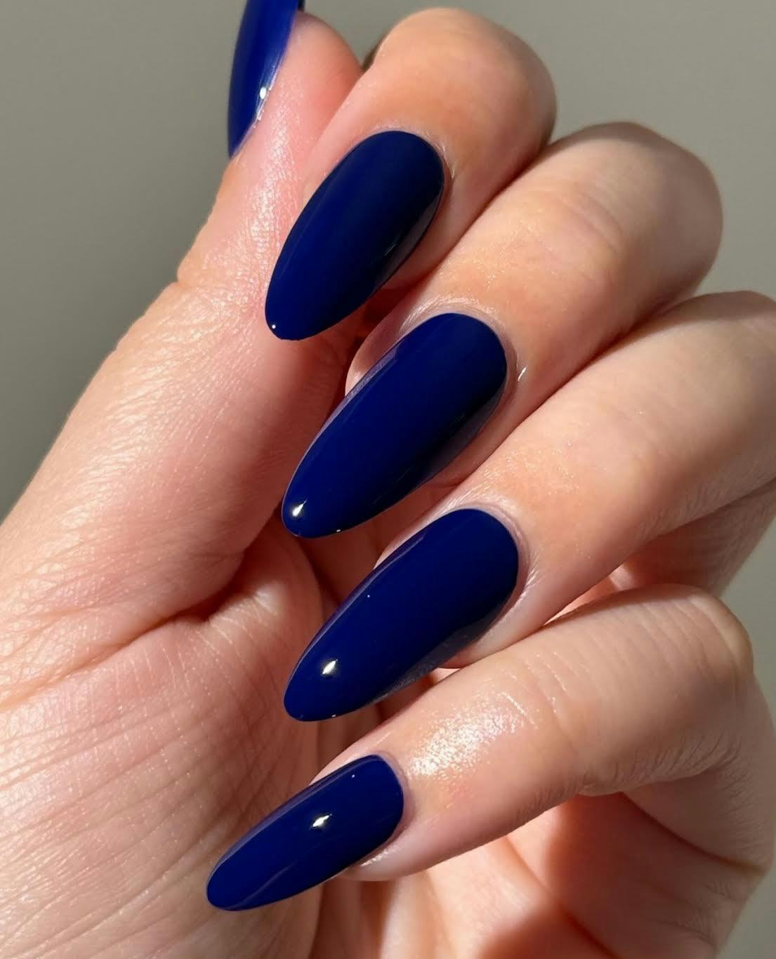 Sapphire blue nails are on-trend for winter 2025.