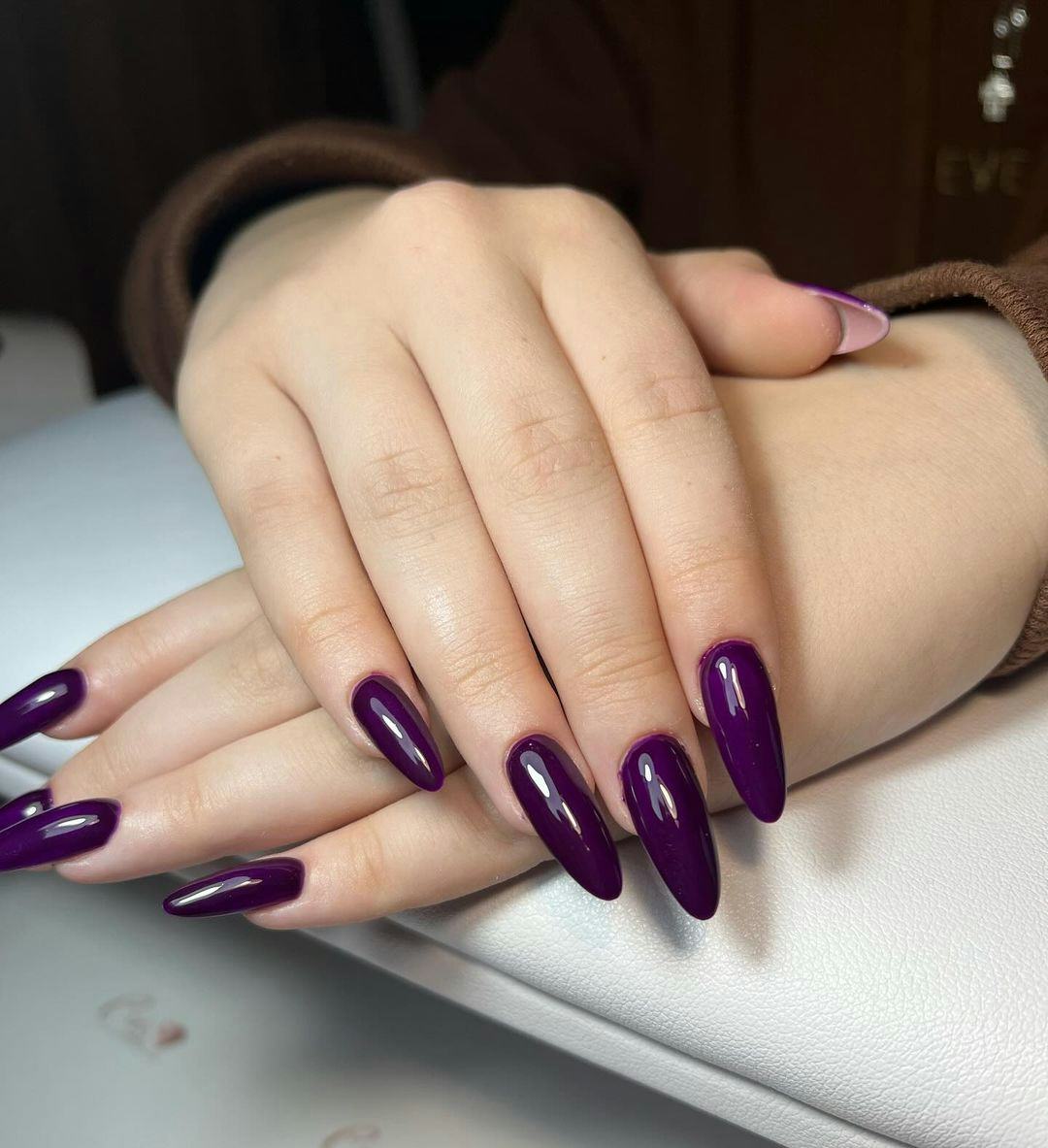 Dark purple nails are on-trend for winter 2025.