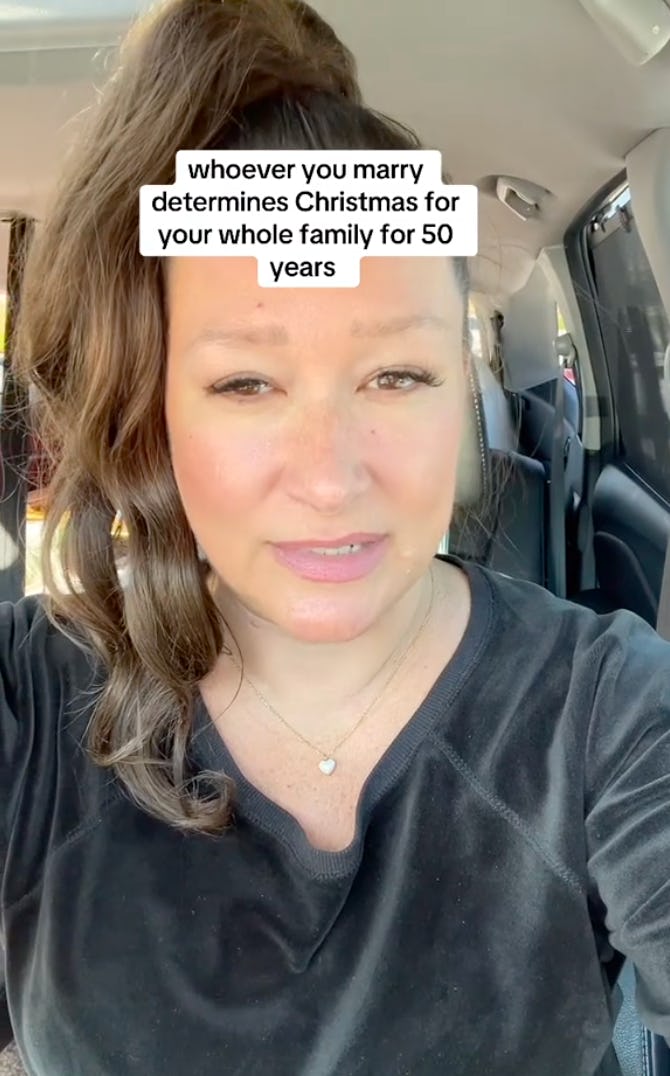 A woman with brown hair in a ponytail speaks directly to the camera from a car, sharing a thought on marriage and family Christmas traditions.