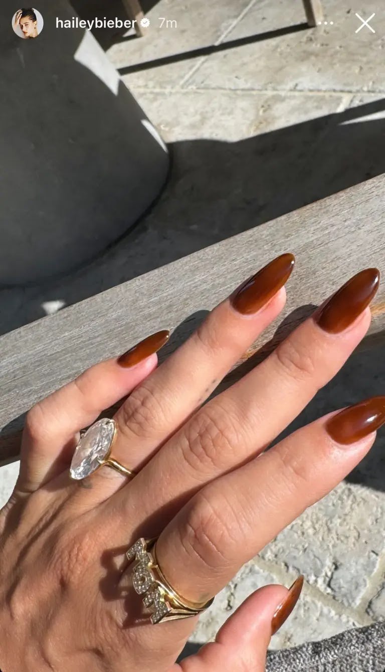 Hailey Bieber showed off a &ldquo;mom&rdquo; ring to mark her new role as a mom.