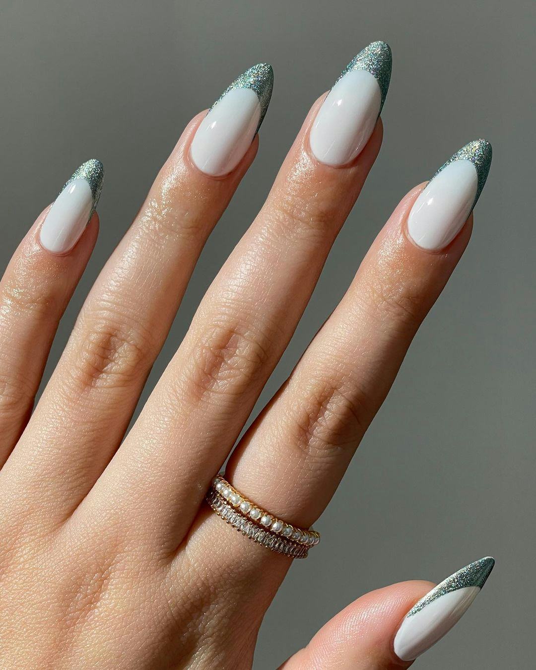 Glitter French tips are on-trend for winter 2025.