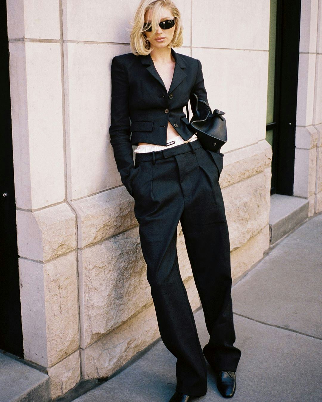 Elsa Hosk wears a black suit with her undies exposed.