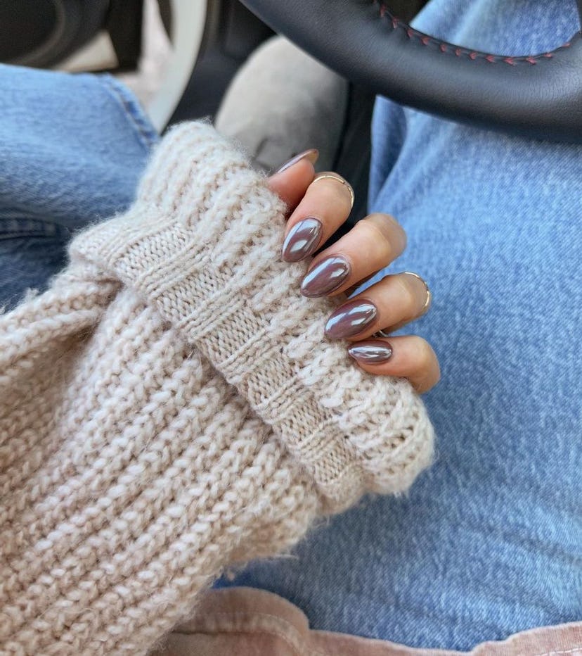 Chocolate glazed donut nails are on-trend for winter 2025.