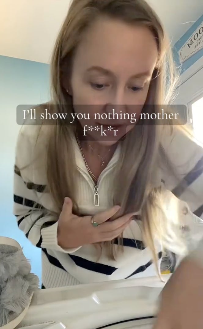 A woman with long hair bends over, appearing focused on an object. The text overlay expresses frustration. The background is a light blue room with natural light.