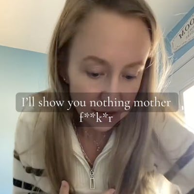 A woman with long hair bends over, appearing focused on an object. The text overlay expresses frustration. The background is a light blue room with natural light.