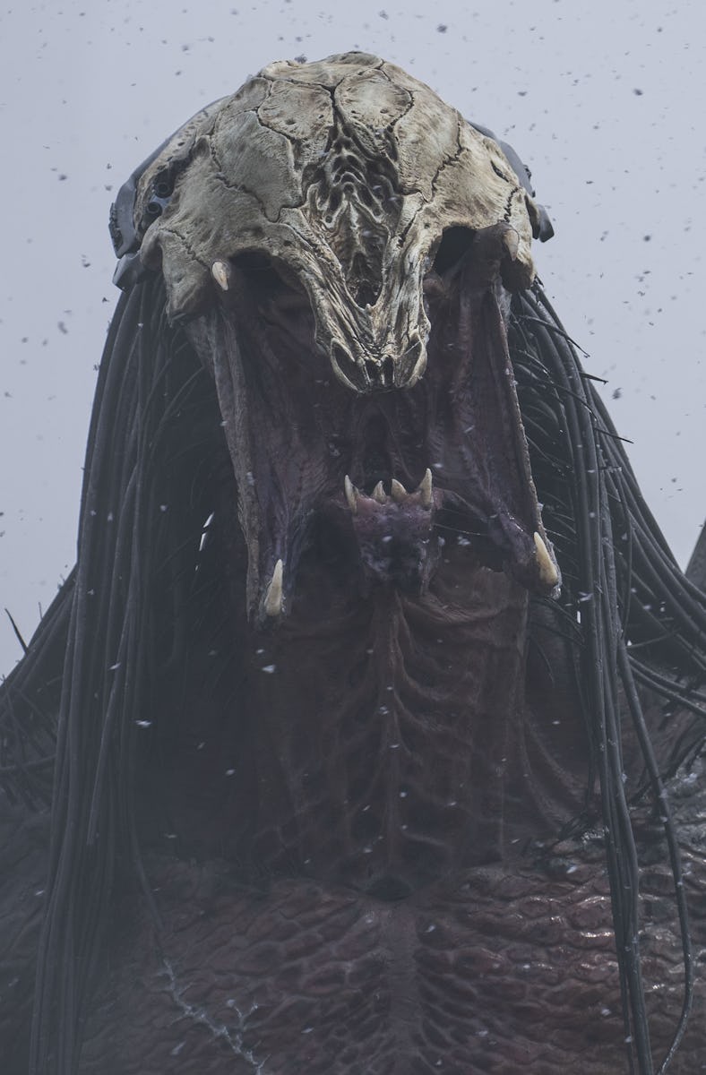 A menacing creature with a skeletal head, long dark hair, and a large open mouth stands amidst falli...