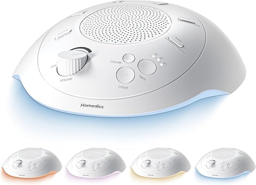 A white sound machine with a textured speaker, control buttons for volume, light, and color settings...