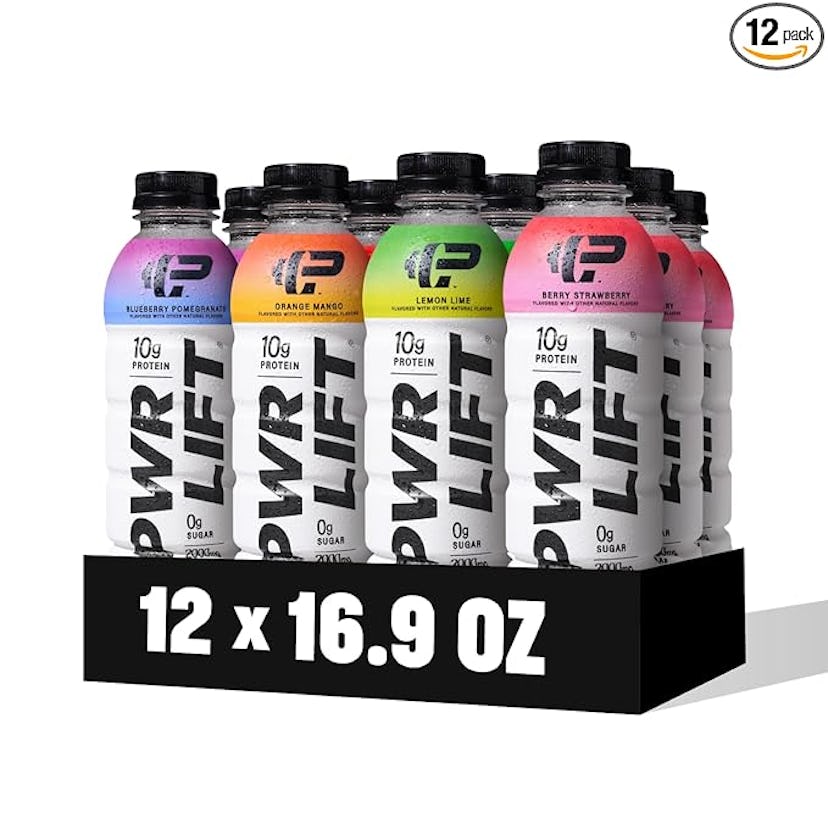 A display of 12 protein drinks in various flavors, including blueberry pomegranate, orange mango, le...