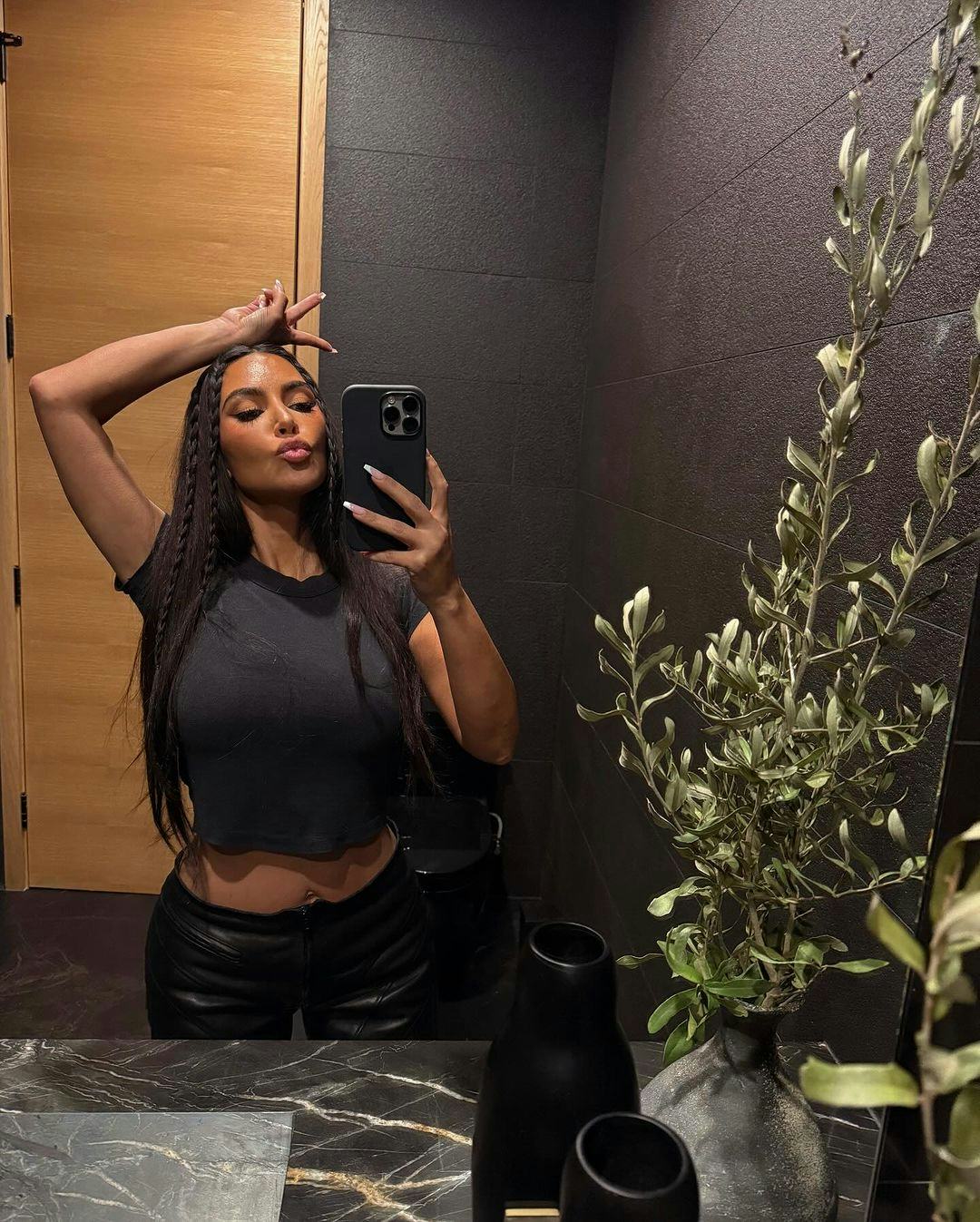 Kim Kardashian is currently rocking hip-length hair with the cutest baby braids.