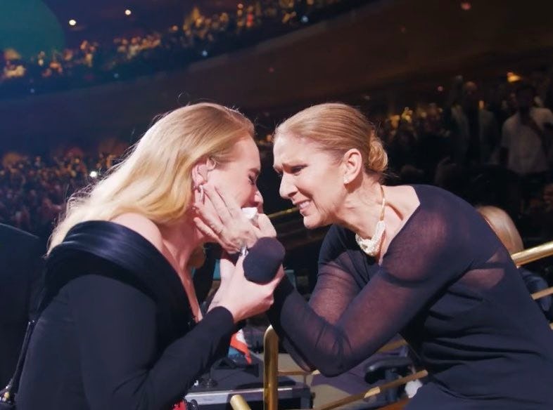 Adele and Celine Dion embrace at the Weekends With Adele show in October 2024.
