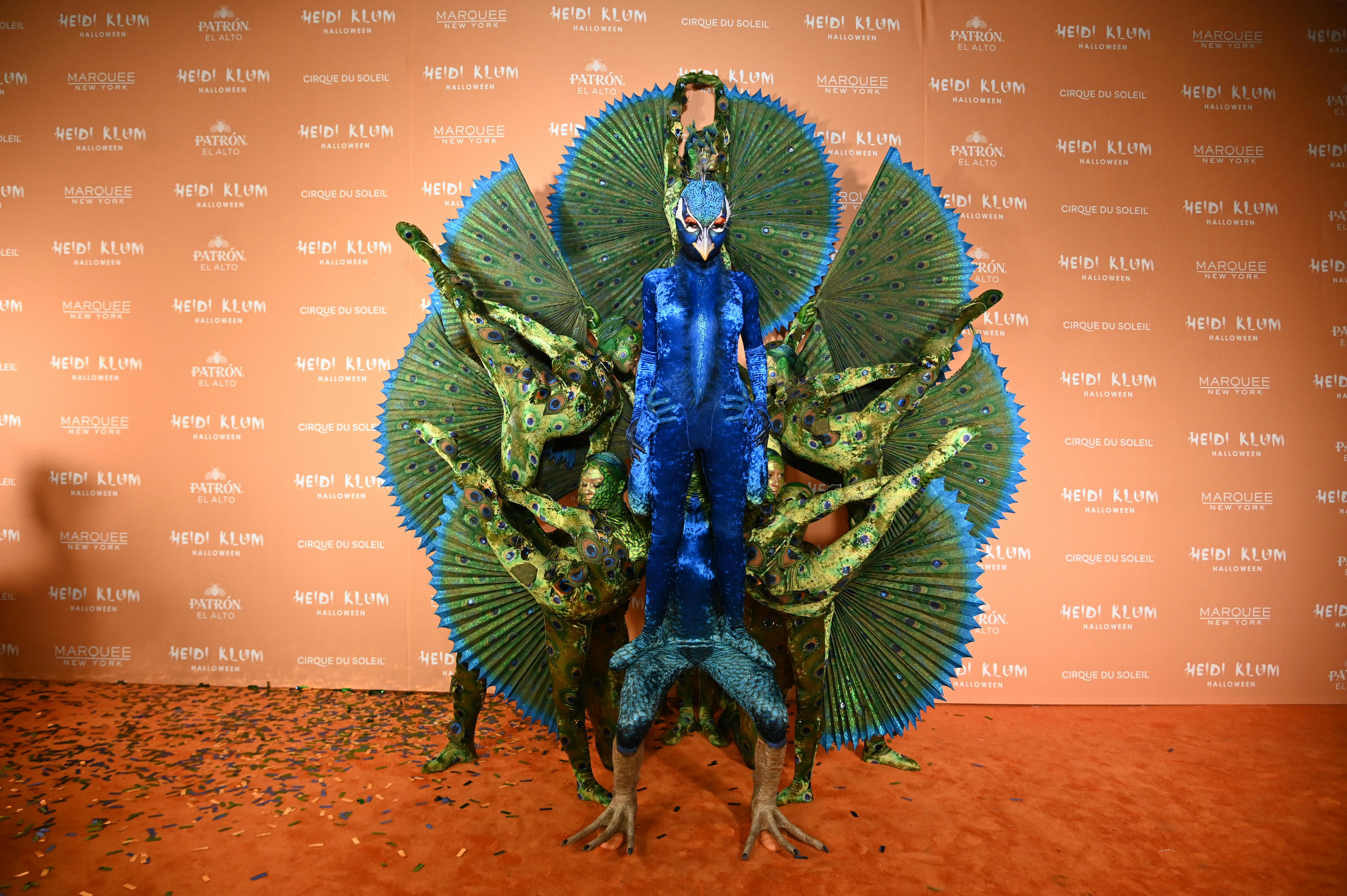 Heidi Klum as a peacock for Halloween 2023.