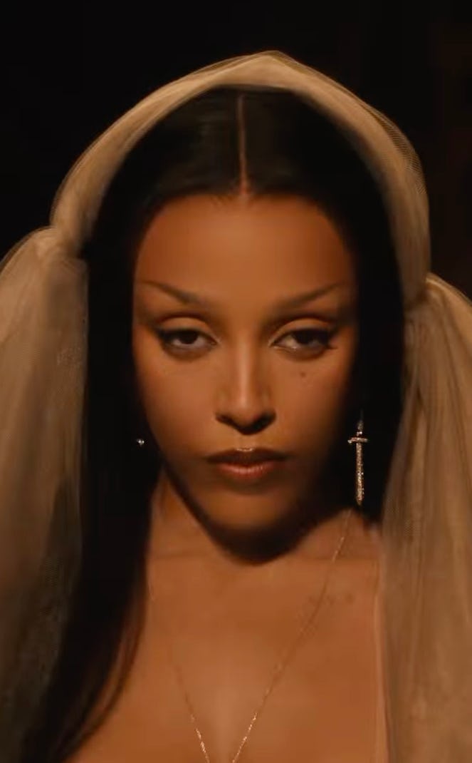 Doja Cat wears a sheer bustier dress.