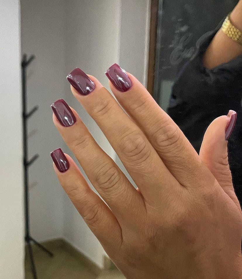 Burgundy chrome nails are on-trend for fall 2024.
