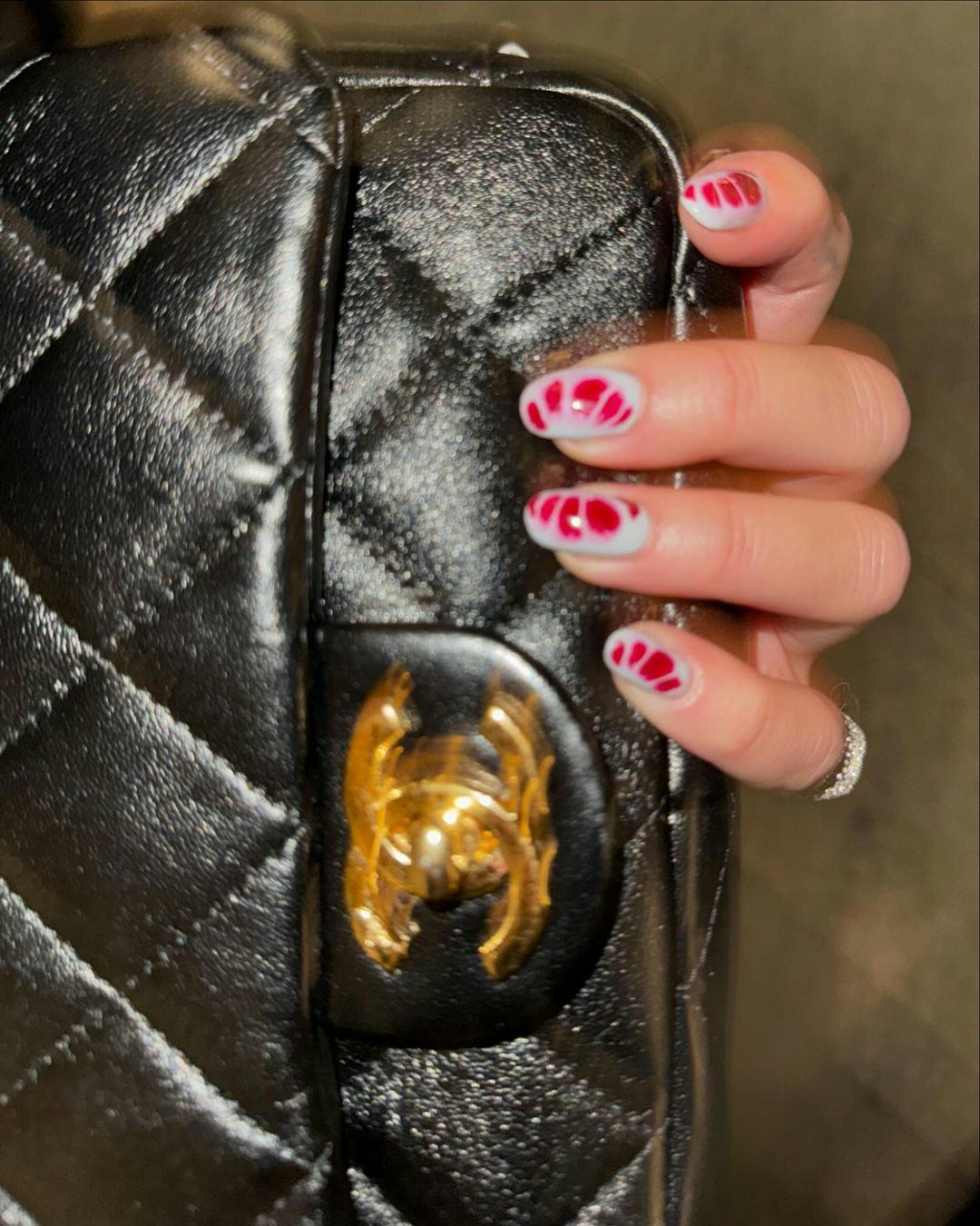 Dua Lipa wears a butter yellow trench coat.