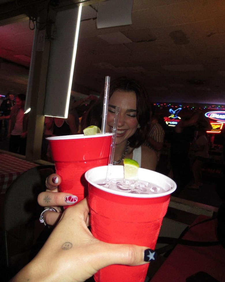 Dua Lipa with a red solo cup.