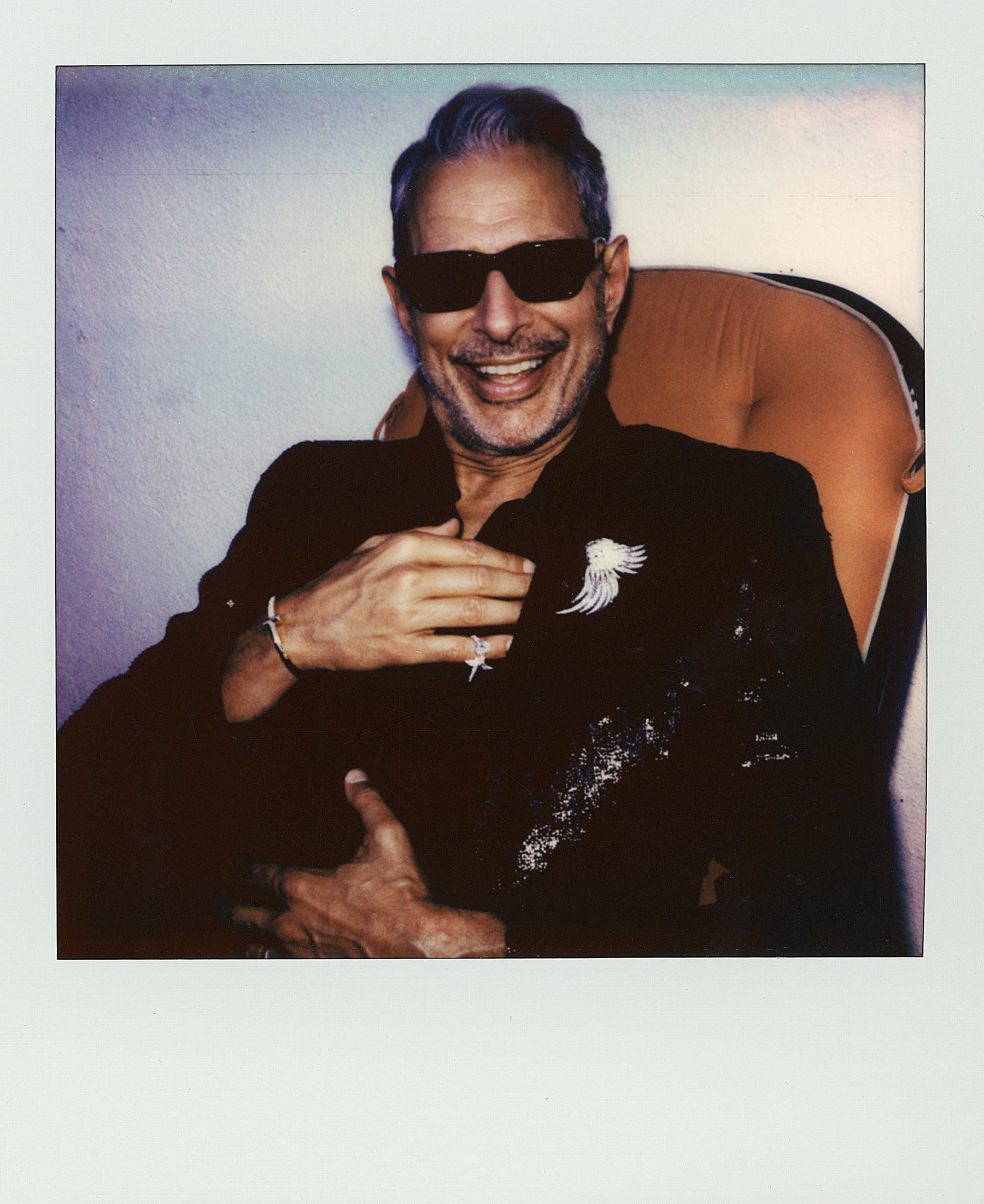 Tom Ford jacket and shirt; Jean Schlumberger by Tiffany & Co. brooch and ring; Tiffany & Co. bracele...