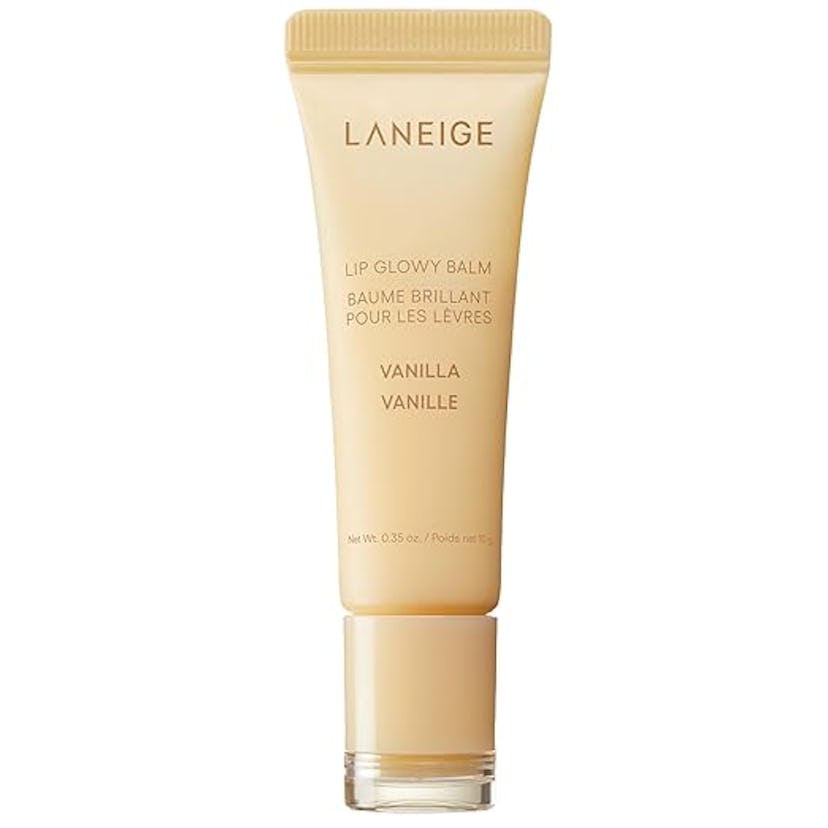 A tube of Laneige Lip Glowy Balm in Vanilla. The tube is light beige with white text, highlighting i...