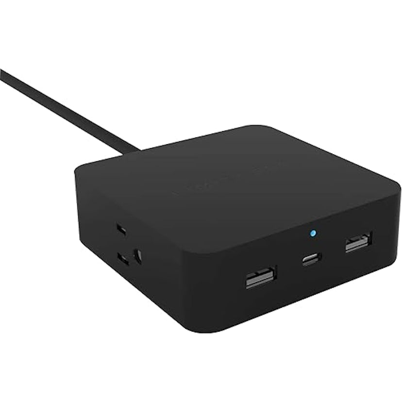 A compact black charging hub with multiple USB ports and a USB-C port, connected by a cable, designe...