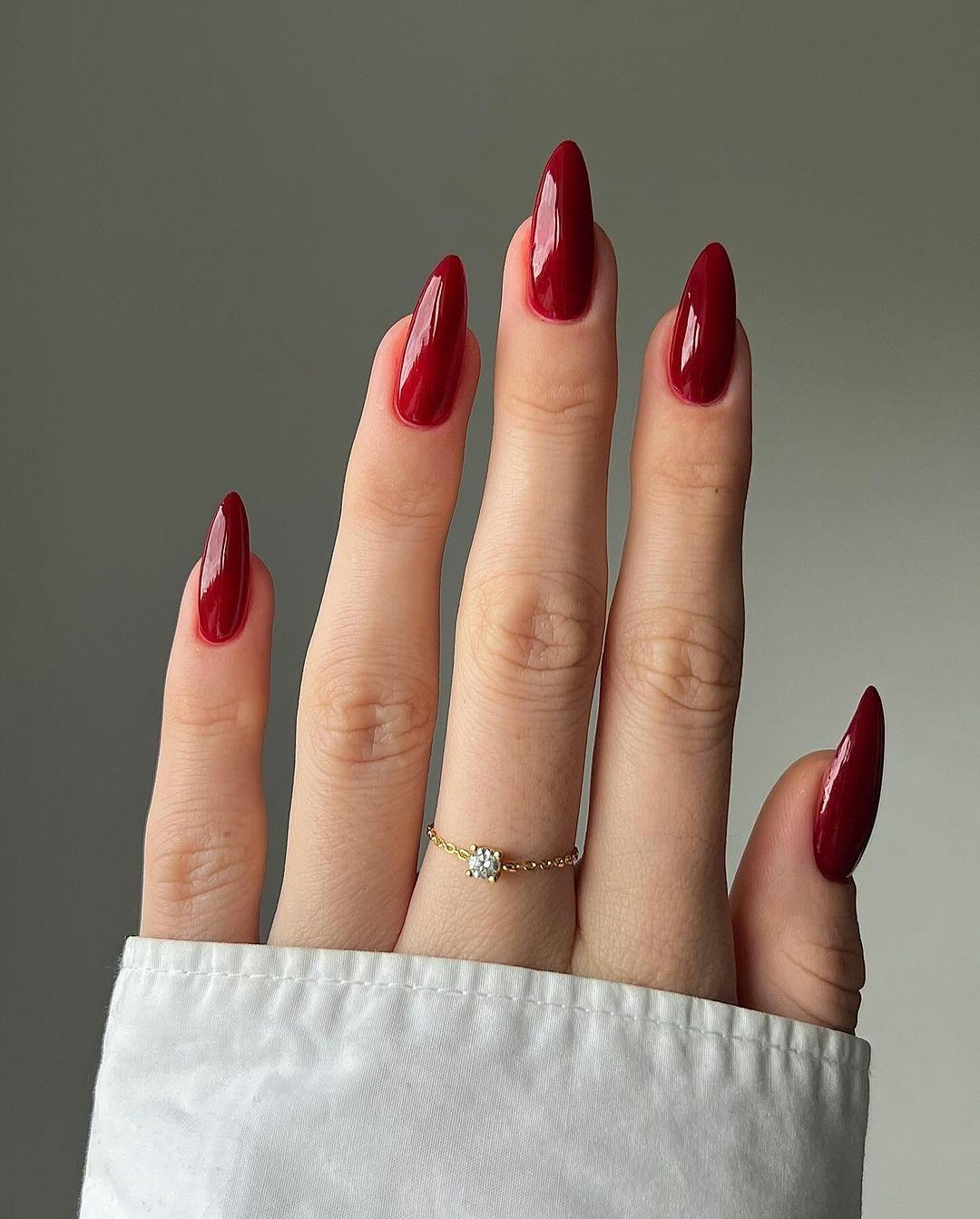 Blood red nails are on-trend for fall 2024.