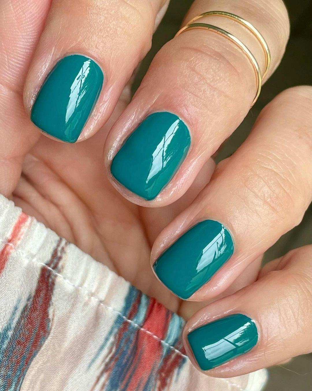 Teal polish is on-trend for fall 2024.