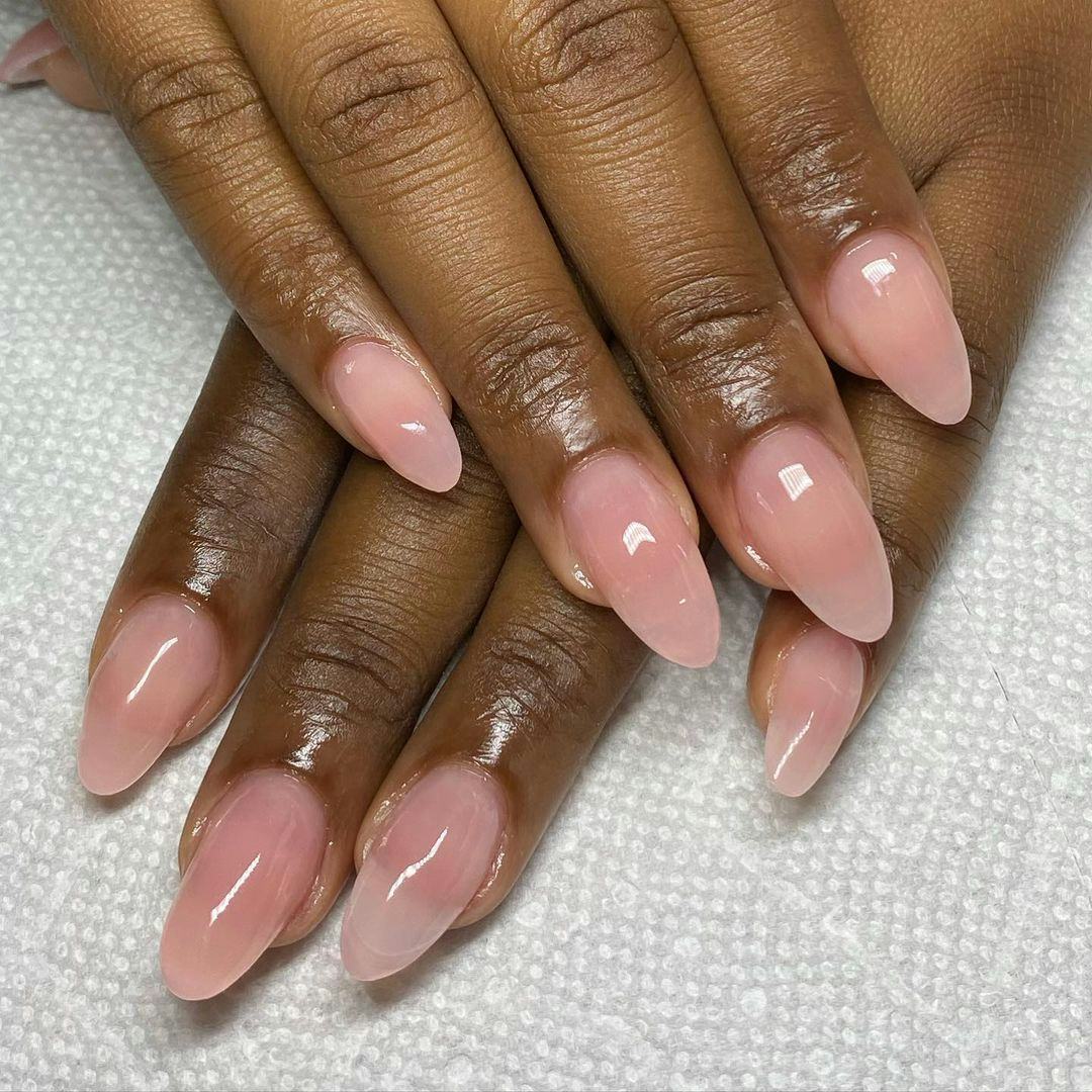 Sheer pink polish is on-trend for fall 2024.