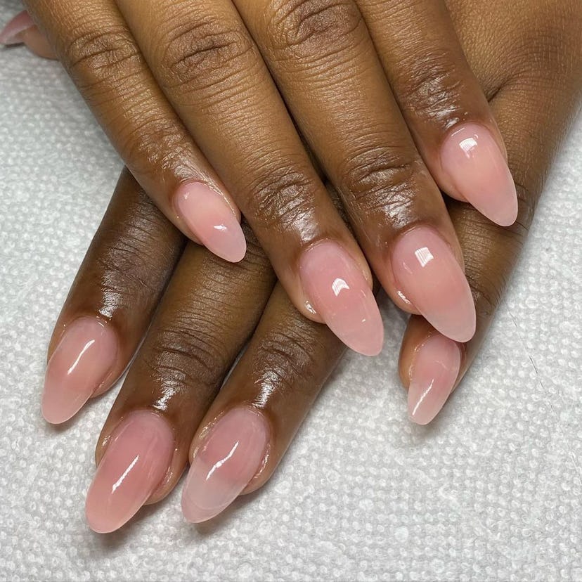 Sheer pink polish is on-trend for fall 2024.