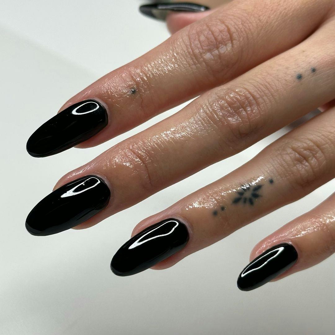 Black polish is on-trend for fall 2024.