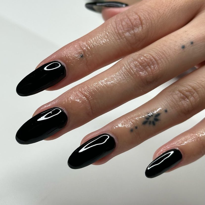Black polish is on-trend for fall 2024.