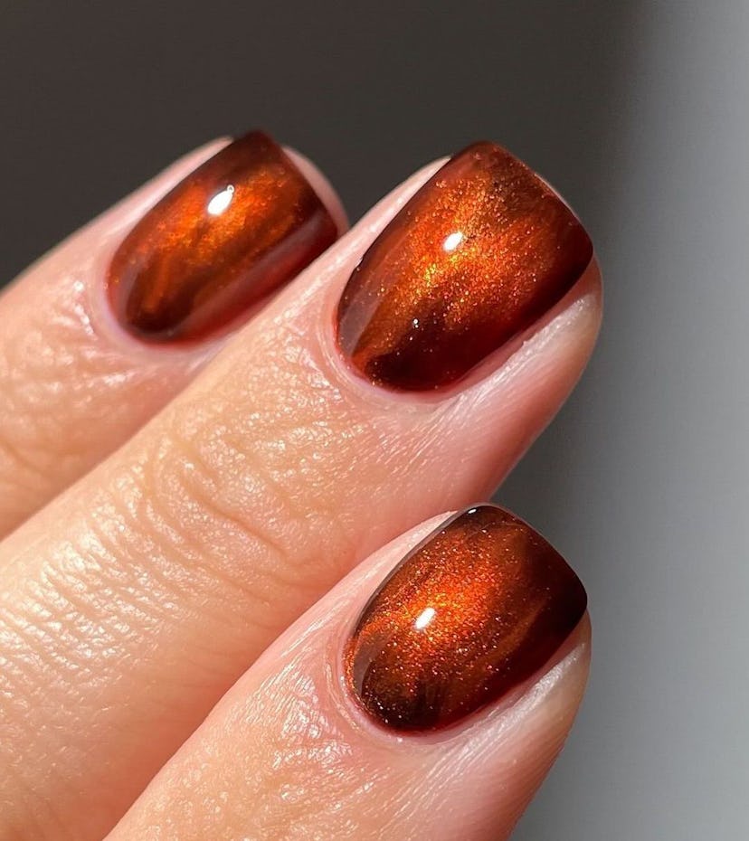 Glittering cognac brown polish is on-trend for fall 2024.