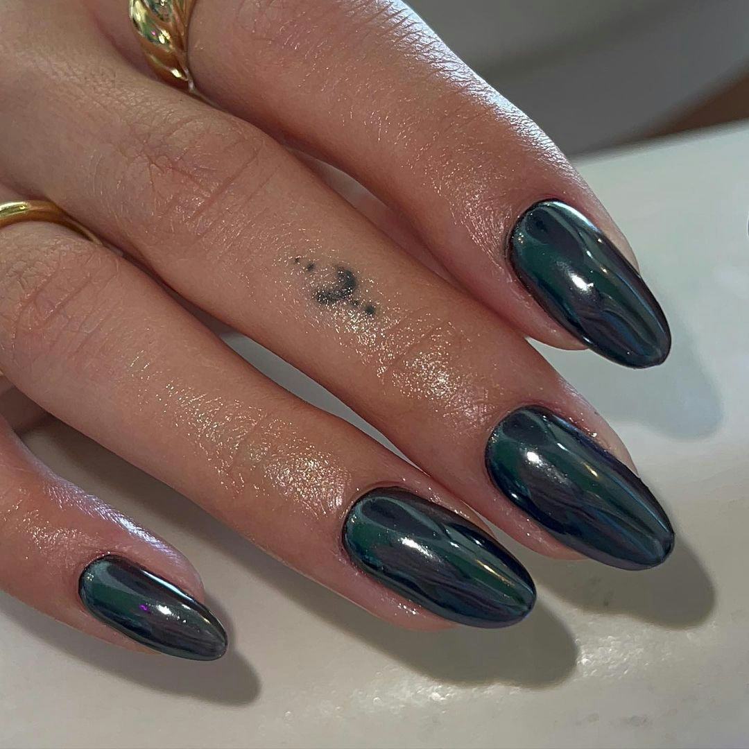 Black chrome nails are on-trend for fall 2024.