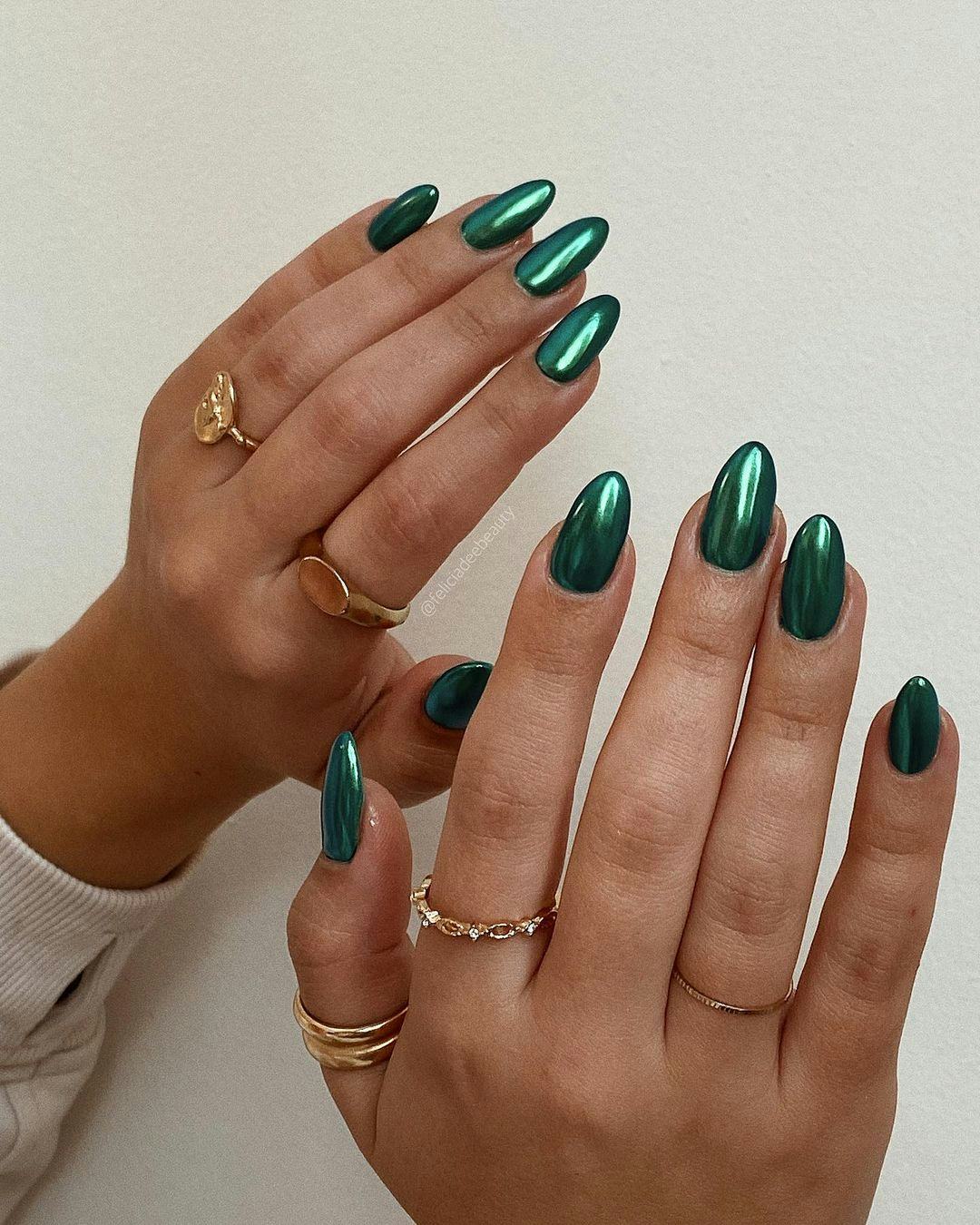 Forest green chrome nails are on-trend for fall 2024.