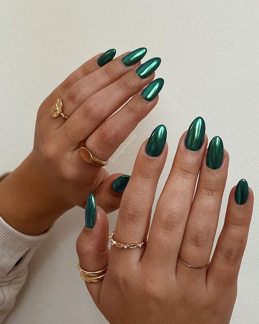 Forest green chrome nails are on-trend for fall 2024.