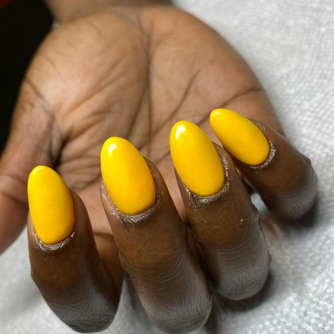 Sunflower yellow polish is on-trend for fall 2024.