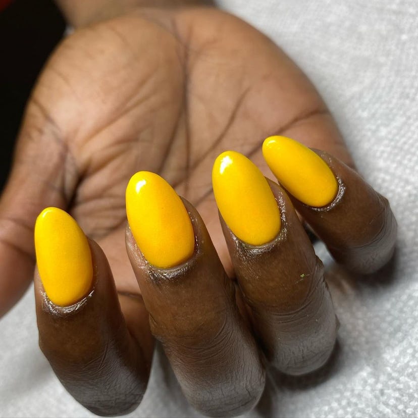 Sunflower yellow polish is on-trend for fall 2024.