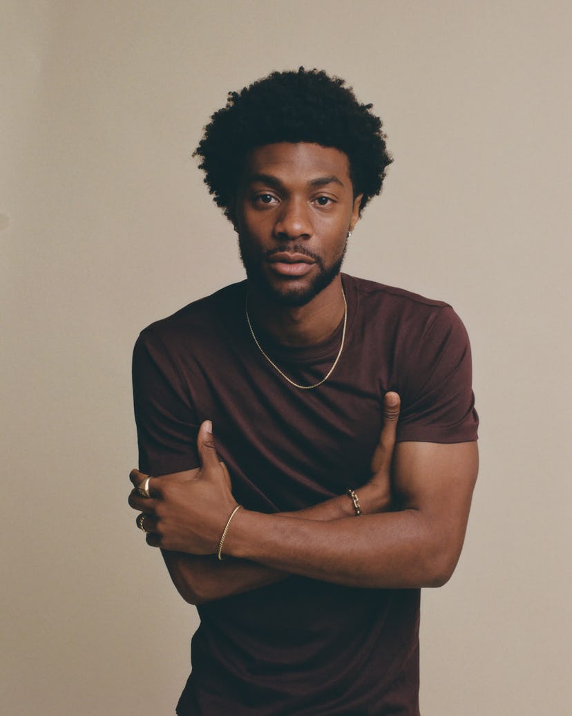 Jonathan Daviss, who plays Pope in Outer Banks Season 4, in a photoshoot for Bustle.