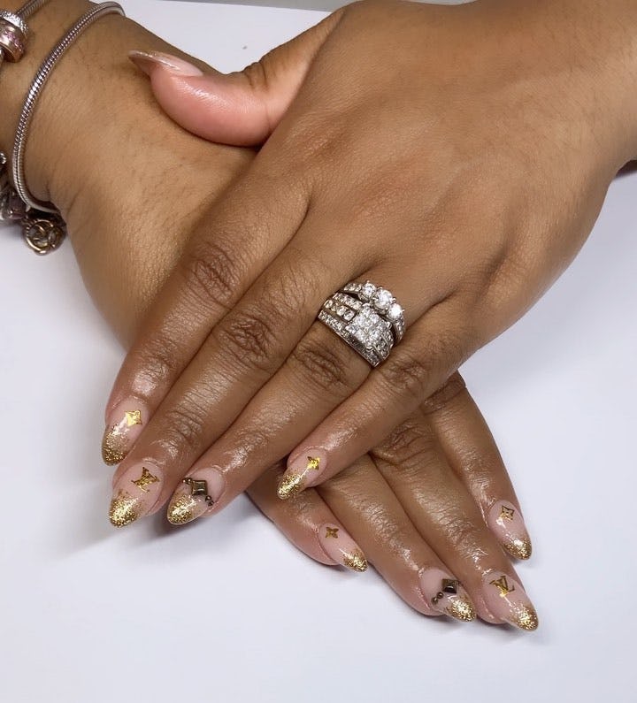 Gold leaf nails match the preppy aesthetic.